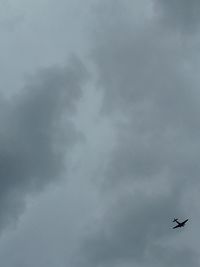 Low angle view of airplane flying in sky