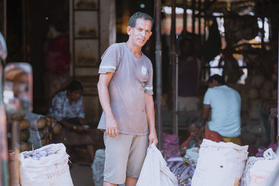 Rear view of woman standing at market