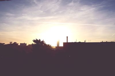 Silhouette of city at sunset