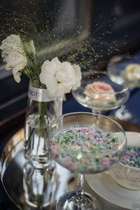 A beautiful composition of dishes and fresh flowers in the water