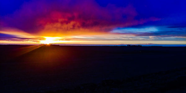 Scenic view of silhouette landscape against sky during sunset