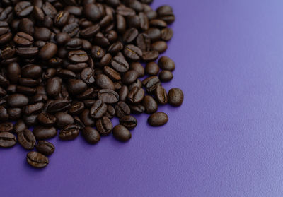 Close-up of coffee beans on table