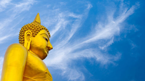 Low angle view of statue against sky