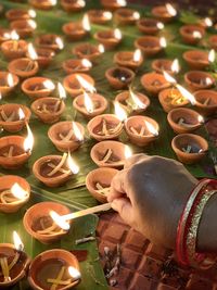 High angle view of hand holding candles