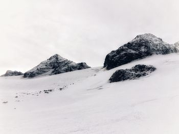 Scenic view of snow mountains against sky