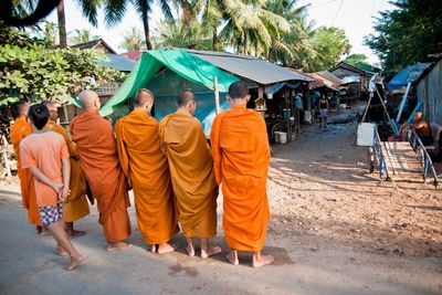 Rear view of people walking in temple