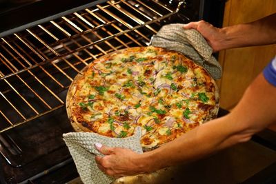 Midsection of man preparing food