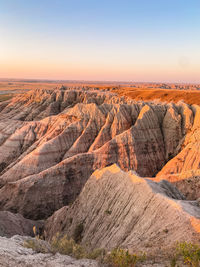 Scenic view of landscape against sky during sunrise 