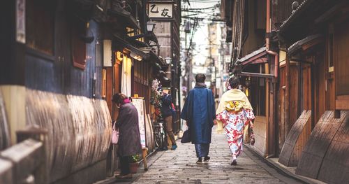Full length of woman walking in alley