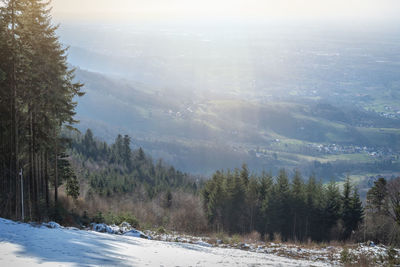 Scenic view of snow covered mountains against sky