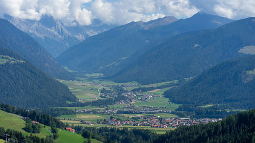 Scenic view of agricultural field and mountains against sky