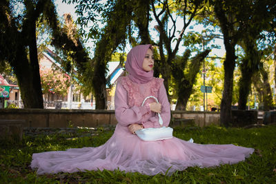 Woman sitting in park