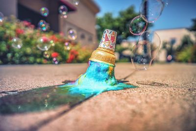 Bubbles over ice cream fallen on road