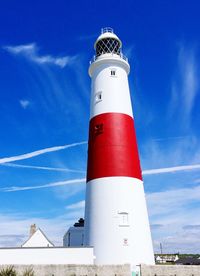 Low angle view of lighthouse against blue sky