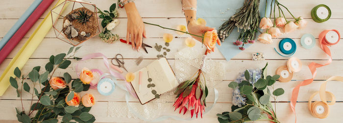 High angle view of various flowers hanging on wall