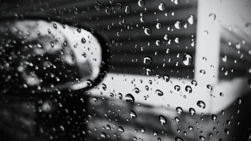 Close-up of water drops on glass window