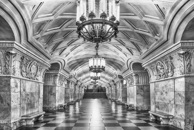 Empty corridor in illuminated subway station