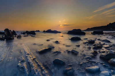 Scenic view of sea against sky during sunset