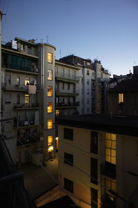 Residential buildings in city against sky