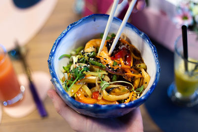 Asian food bowl bowl with shrimp, vegetables and rice noodles