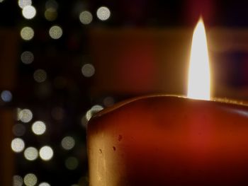 Close-up of lit lamp at night