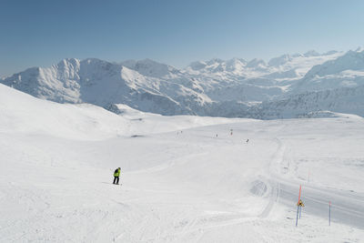 Scenic view of snowcapped mountain against clear sky