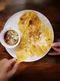 High angle view of person holding breakfast