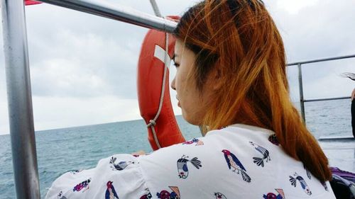 Side view of boat in sea against sky