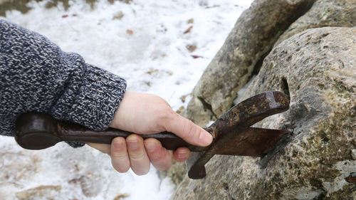 Close-up of hand holding ice cream