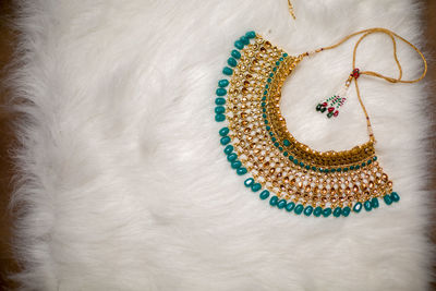 High angle view of necklace on fur