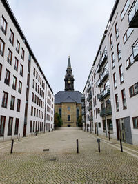 Church between modern buildings