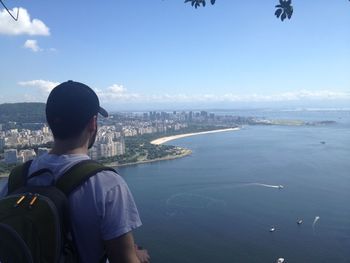 Man looking at sea against sky