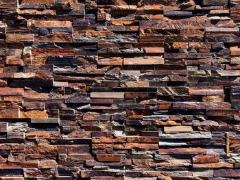 Full frame shot of wooden logs in forest