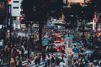 Crowd walking on road in city