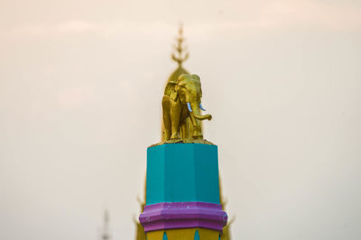 Close-up of statue against sky