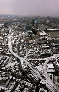 High angle view of city buildings against sky