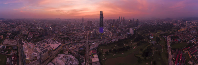 High angle view of city buildings during sunset