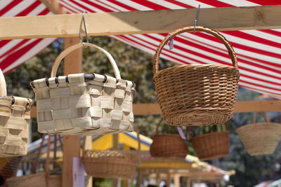 Close-up of wicker basket hanging at market stall