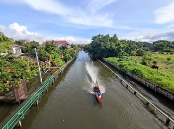 Panoramic view of river amidst trees against sky