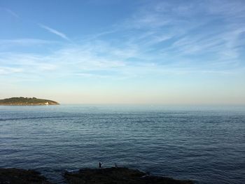 Scenic view of sea against sky at sunset