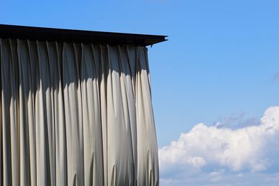 Low angle view of building against blue sky