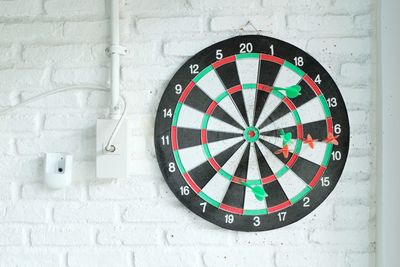 Dart board on white wall