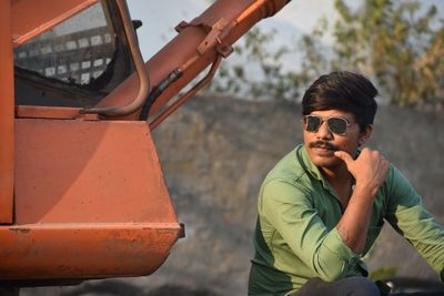 Portrait of young man in sunglasses