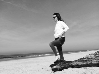 Man standing on beach against sky