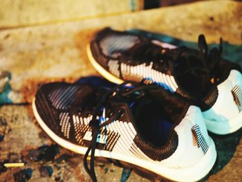 Close-up of old shoes on table