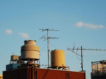 Low angle view of factory against sky