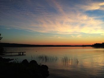 Scenic view of lake at sunset