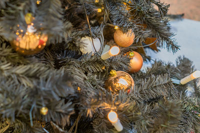 Christmas and new year holidays background. christmas tree decorated with gold balls. 