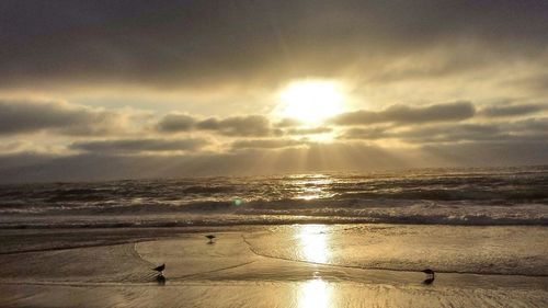 Scenic view of sea against sky at sunset