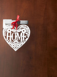 Heart shape tag with home text on door handle